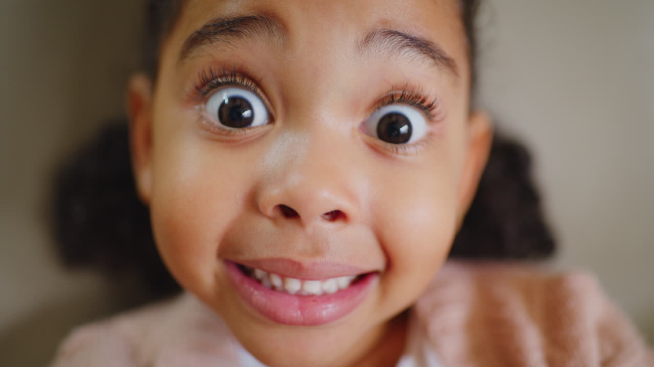 Closeup of a girl showing her teeth at a dentist