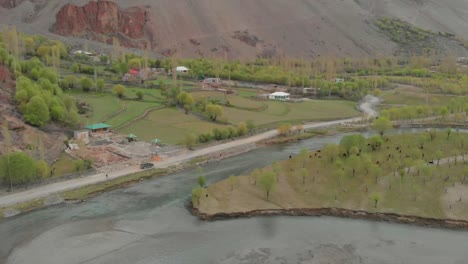 aerial above ghizer river with suv parked on rural road