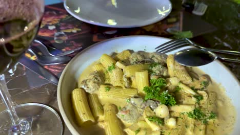 pasta and wine on a dining table