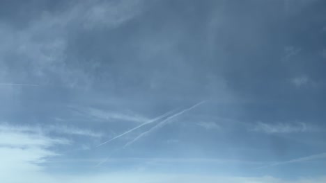 breathtaking scene from above: soaring through wispy clouds