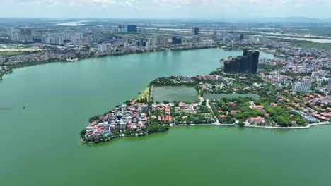 cinematic aerial moving shot of the tay ho lake in hanoi, vietnam, asia, drone mavic 3 classic, 4k