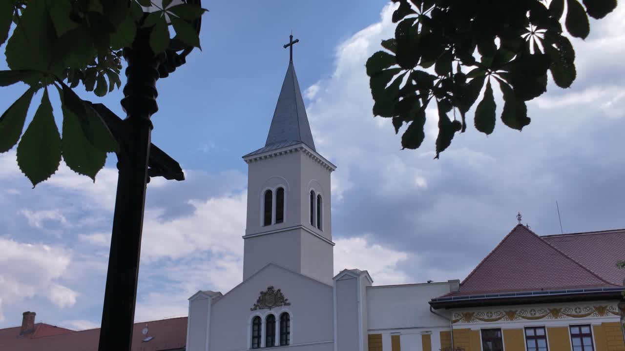 Exterior view of Our Lady Church of the Female Order of Notre Dame in Pécs, highlighting its ornate facade and historic architecture