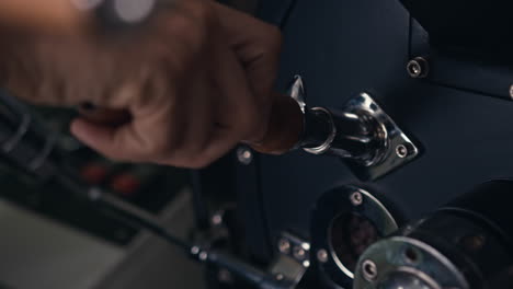 coffee beans being added to roasting machine