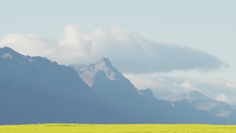 general view of countryside landscape with fields and mountains