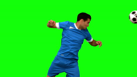 Handsome-man-heading-a-football-on-green-screen