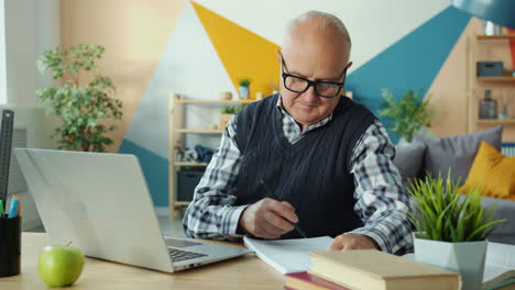 senior citizen studying at home
