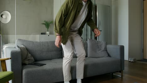 man receiving a package at home