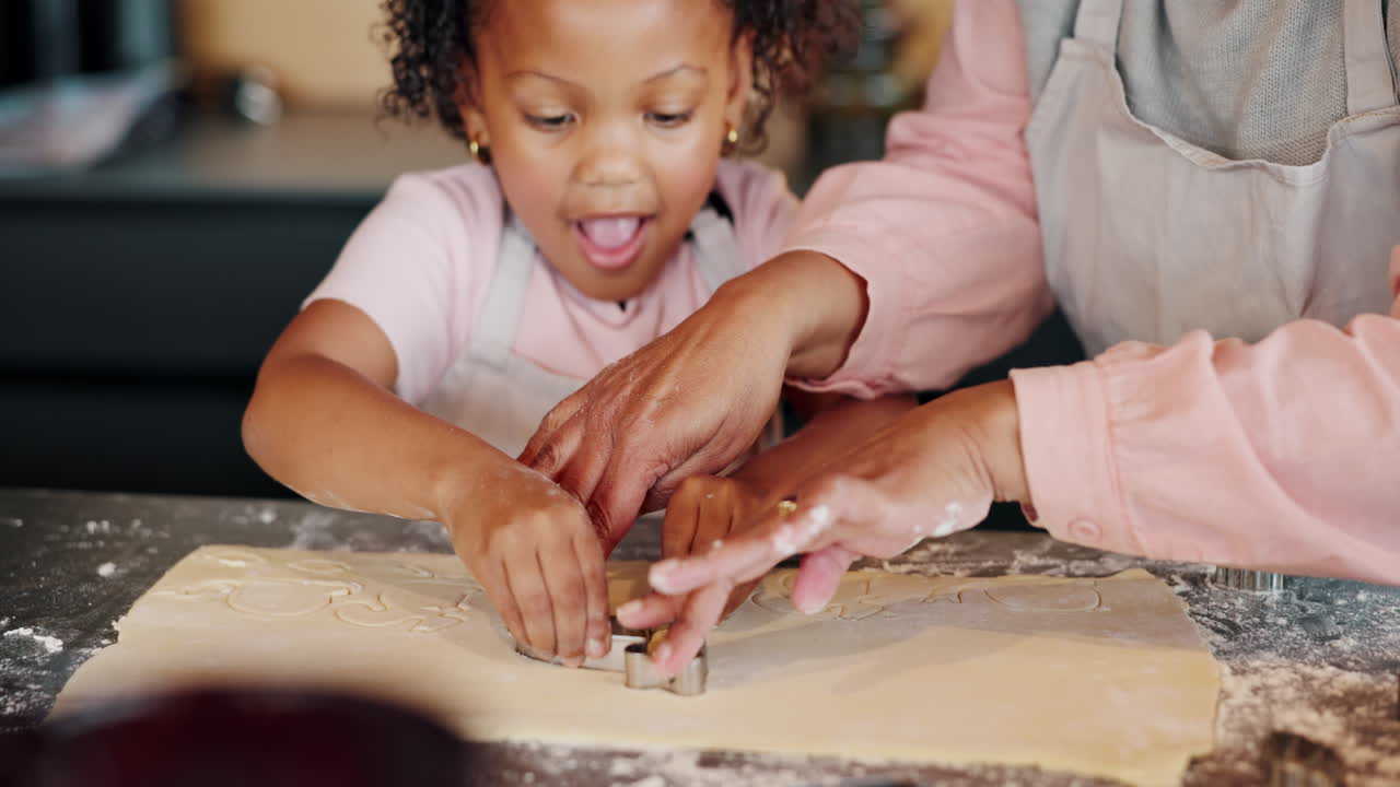 Child and grandparent baking cookies