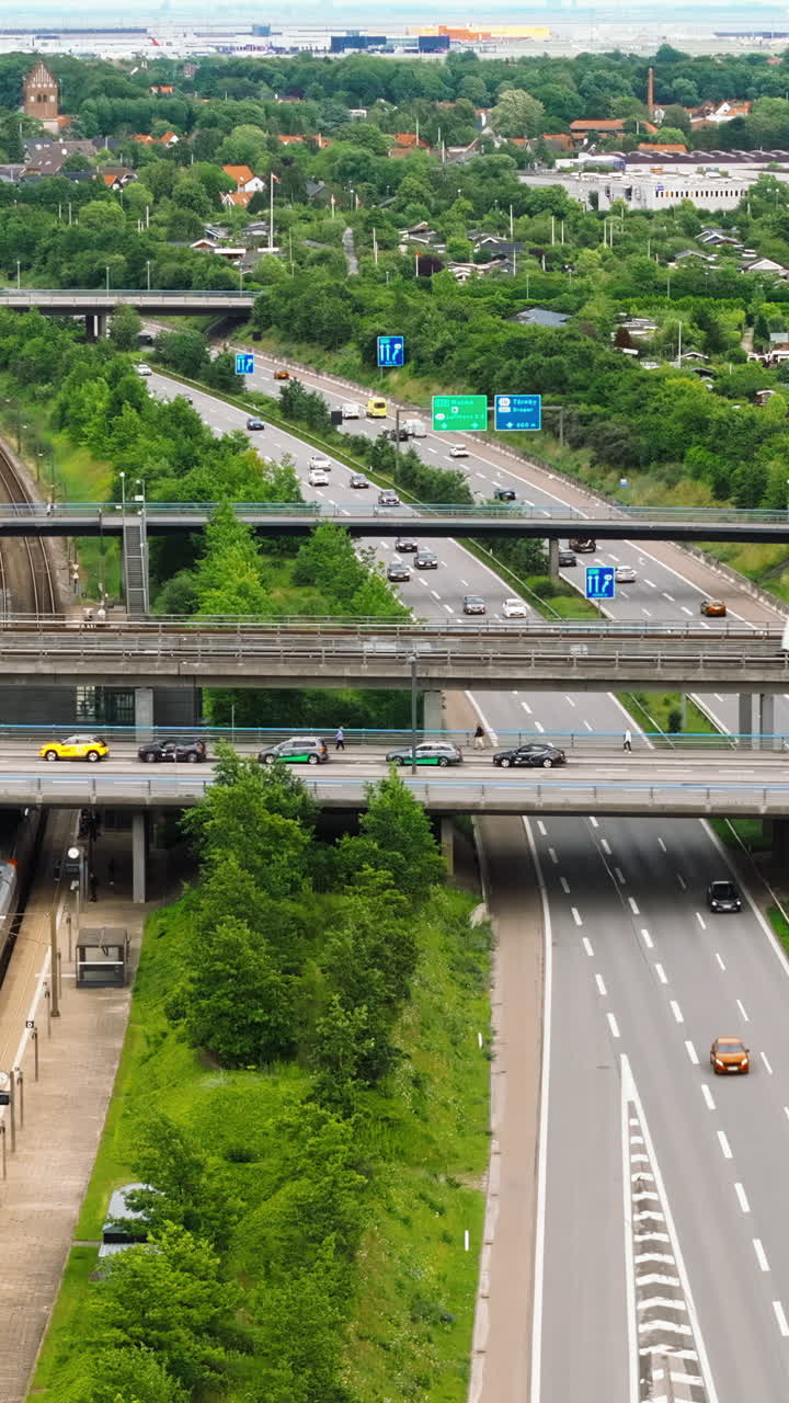 Aerial drone view of the European route E20 on a cloudy day. Vertical