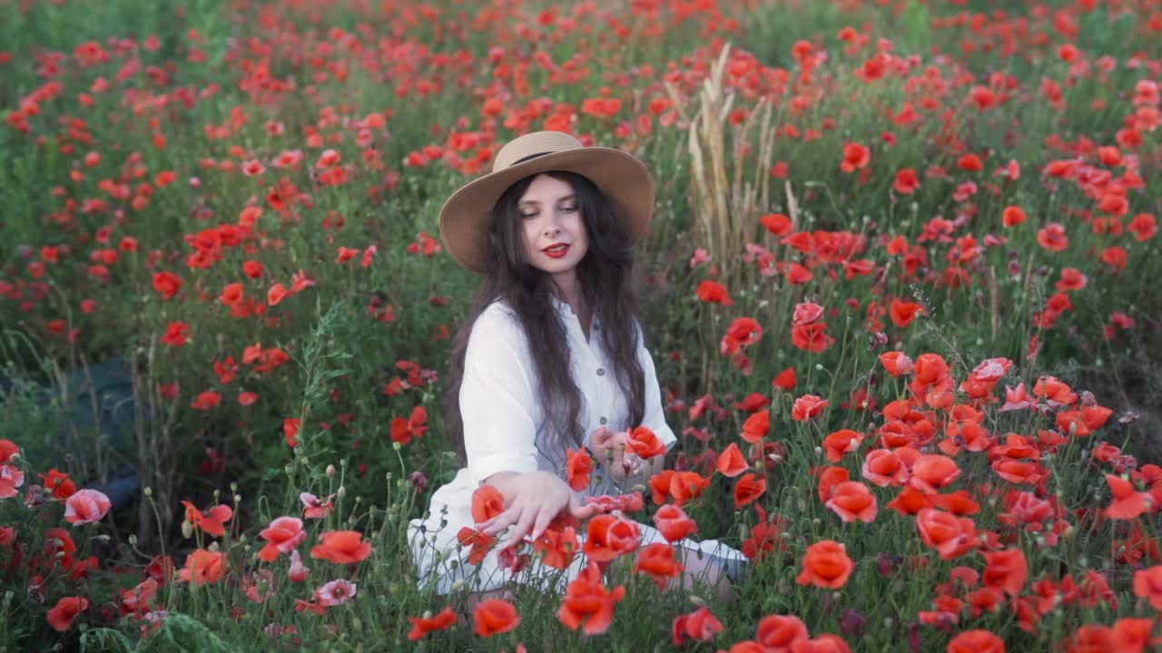 Woman in a Red Poppy Field