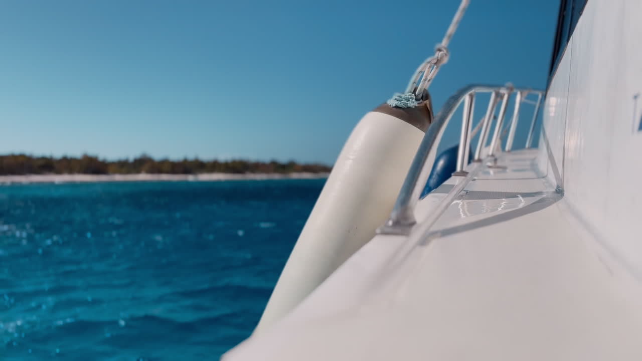 Close up of a fender hangin in the side of a boat sailing in the Caribbean Sea, Cuba.