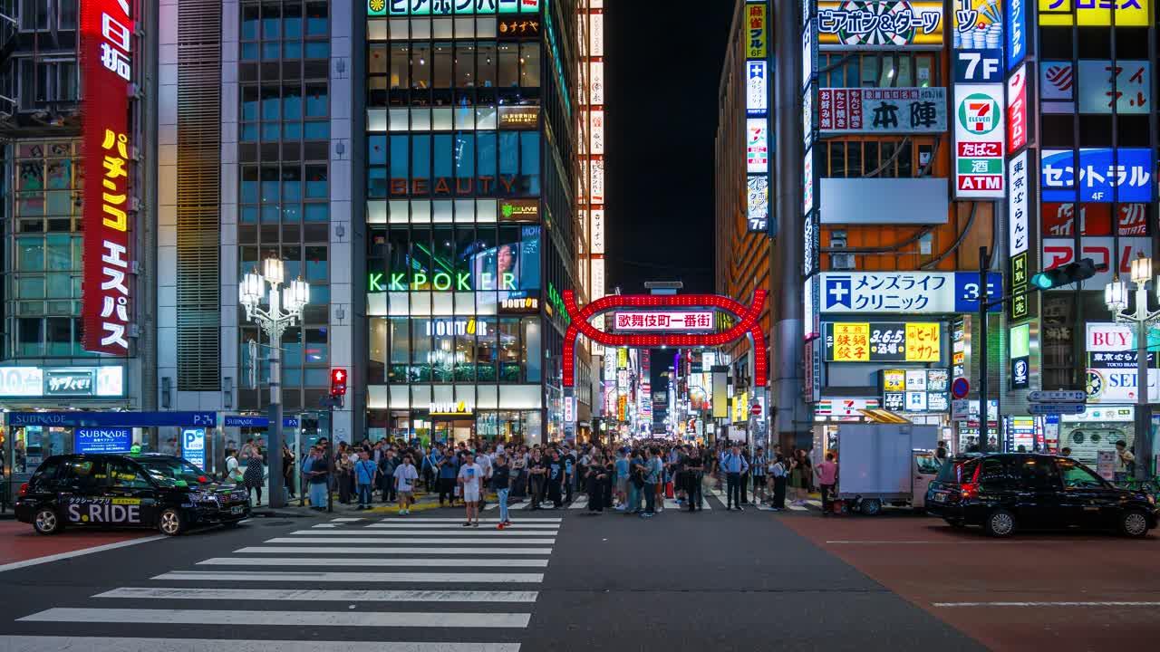 Crowds of people crossing the road in Shinjuku red light district, time lapse