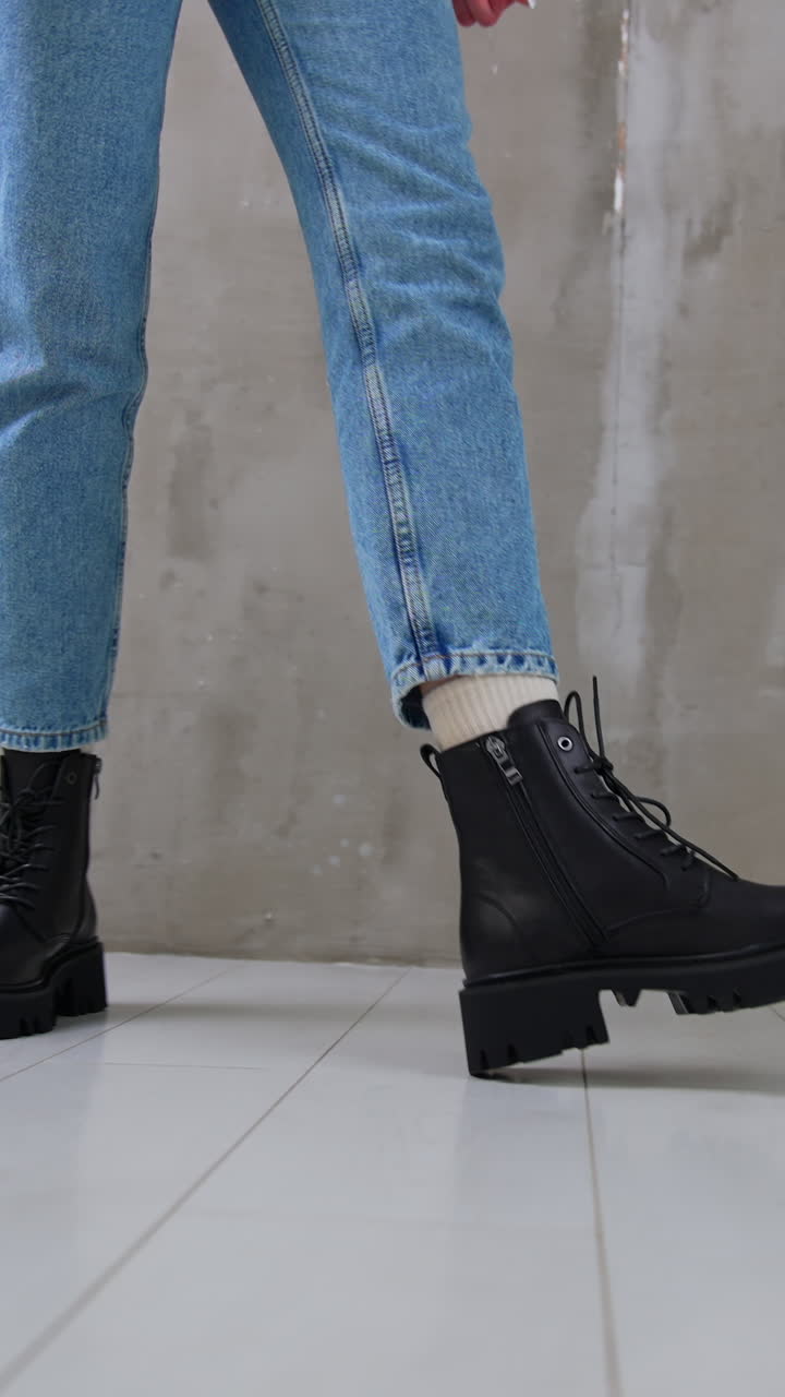 Woman Wearing Black Platform Boots with Blue Jeans