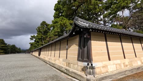 A peaceful walk beside an ancient Japanese wall