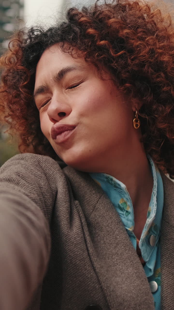 Happy Young Woman Waving at the Camera in the City
