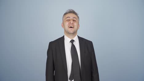 businessman winking at camera.