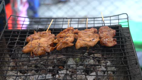 Bbq-Meat-Skewers-Grilling-On-Charcoal-Grill,-street-food-in-Bangkok