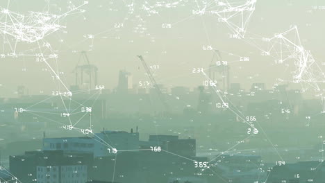 animation of numbers around connected dots over aerial view of fog covered cityscape