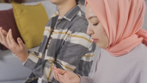 to pray. muslim man and woman praying.