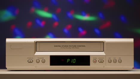 retro vhs vcr with hand operating it