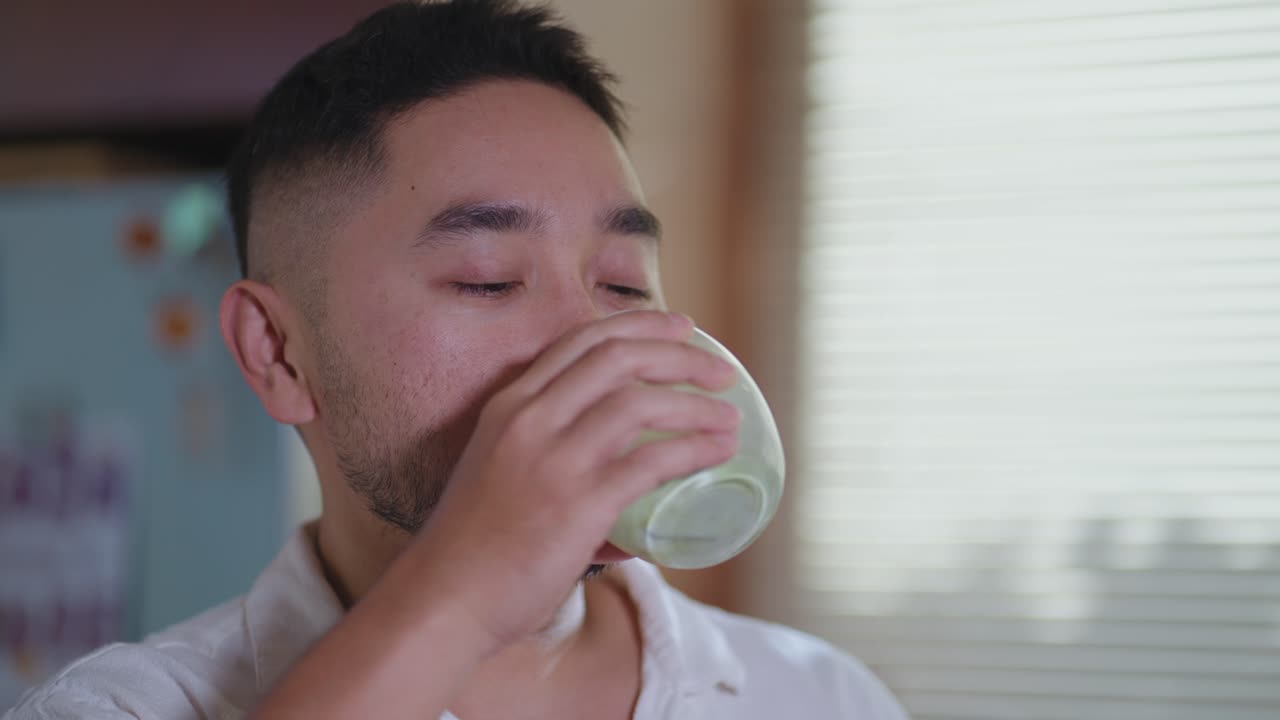 Man drinking green tea
