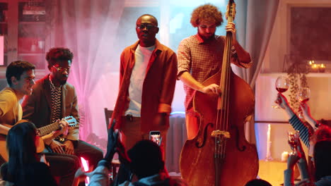 african american man singing and giving concert with band