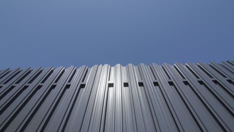 Grey-metal-fence-against-blue-sky-2