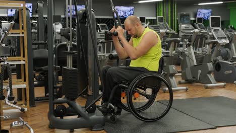 man with disabilities training in the gym of rehabilitation center