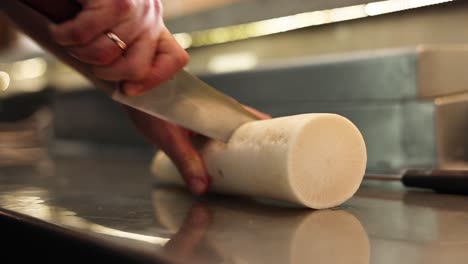 chef cutting a radish