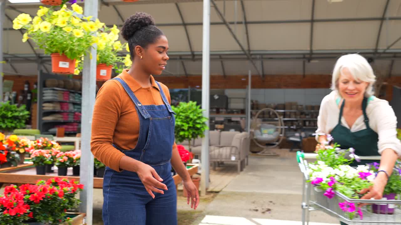 People shopping for flowers at a garden center