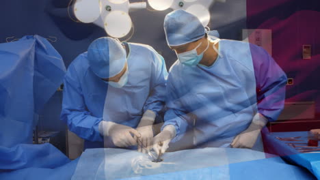 animation of flag of france waving over surgeons in operating theatre