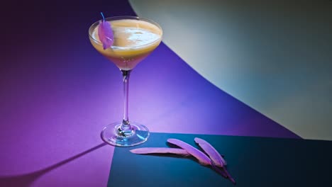 purple cocktail with feathers