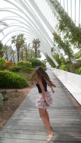 girl running and looking in city park