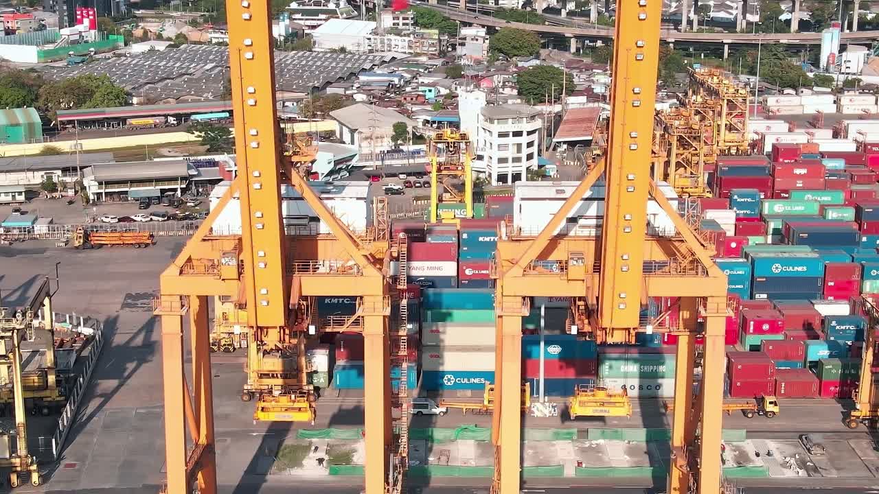 Crane operation at a busy shipping port in Bangkok