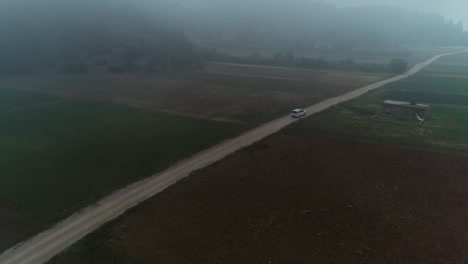 foggy countryside road: a serene aerial view