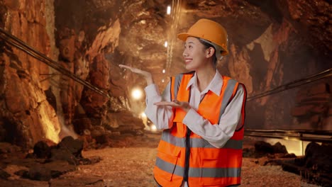 female engineer presenting in a mine tunnel