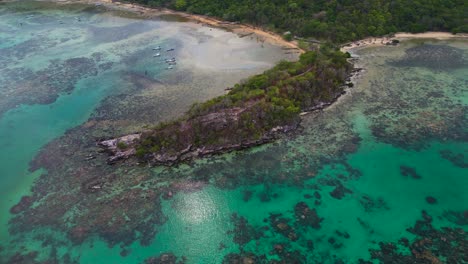 Reverse-Dolly-aerial-panoramic-view-of-Karimunjawa-Island-during-low-tide-day,-turquoise-sea-water-and-it-coral-reef