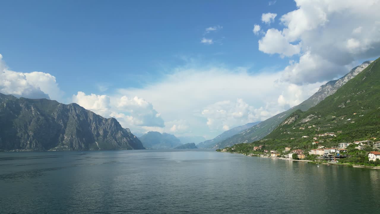 Lake Garda with steep mountains and coastal villages. Lago di Garda, Italy