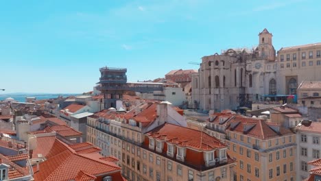 Backwards-Shot-Of-Astonishing-Rossio-Square,-,Santa-Justa-Lift,-Lisbon