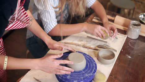 women learning pottery