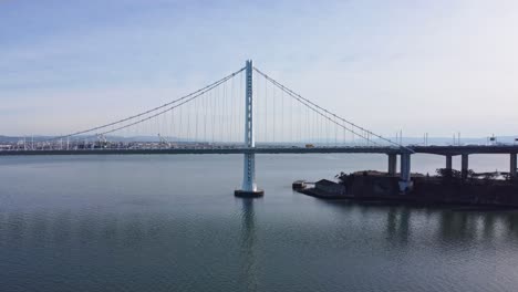 drone footage moving along the san francisco bay bridge