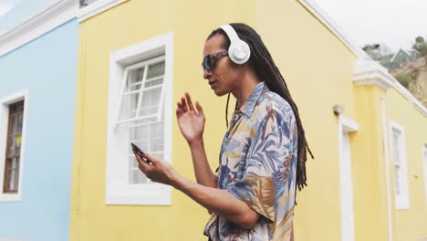 mixed race man listening to music with headphone