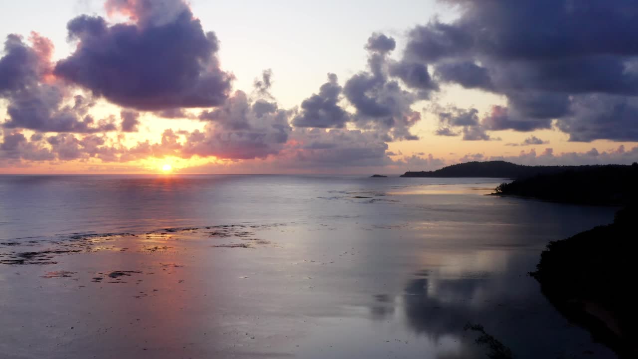 Breathtaking sunrise on the Na Pali coast. Aerial drone shot filmed in 4K in Princeville, Kauai, Hawaii