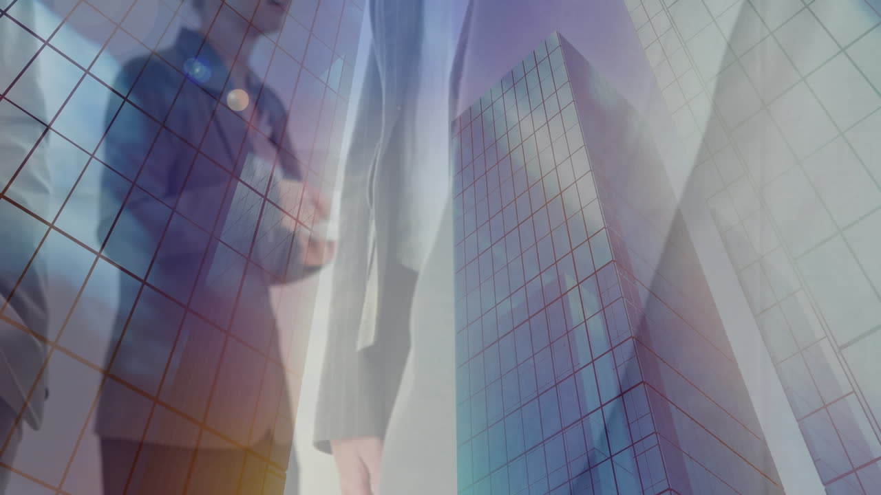 Digital composition of mid section of businesspeople shaking hands against tall buildings
