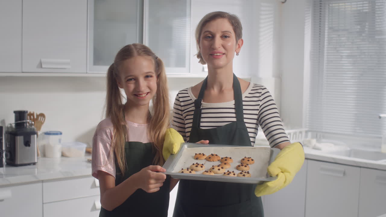 Portrait of Mother and Daughter with Baked Chocolate Cookies