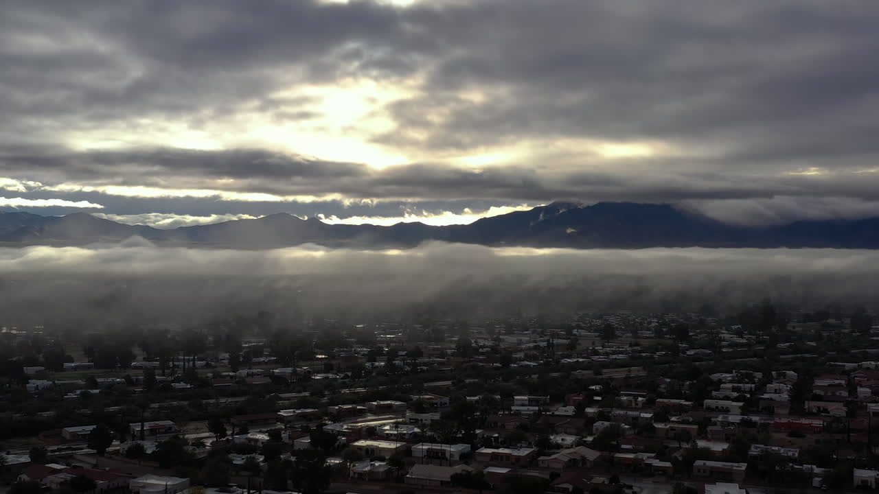 Cinematic 4k drone Green Valley Tucson Arizona, thick fog over city