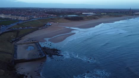 Tynemouth Old Victorian Outdoor Pool and Tynemouth Longsands with soothing waves in the sea