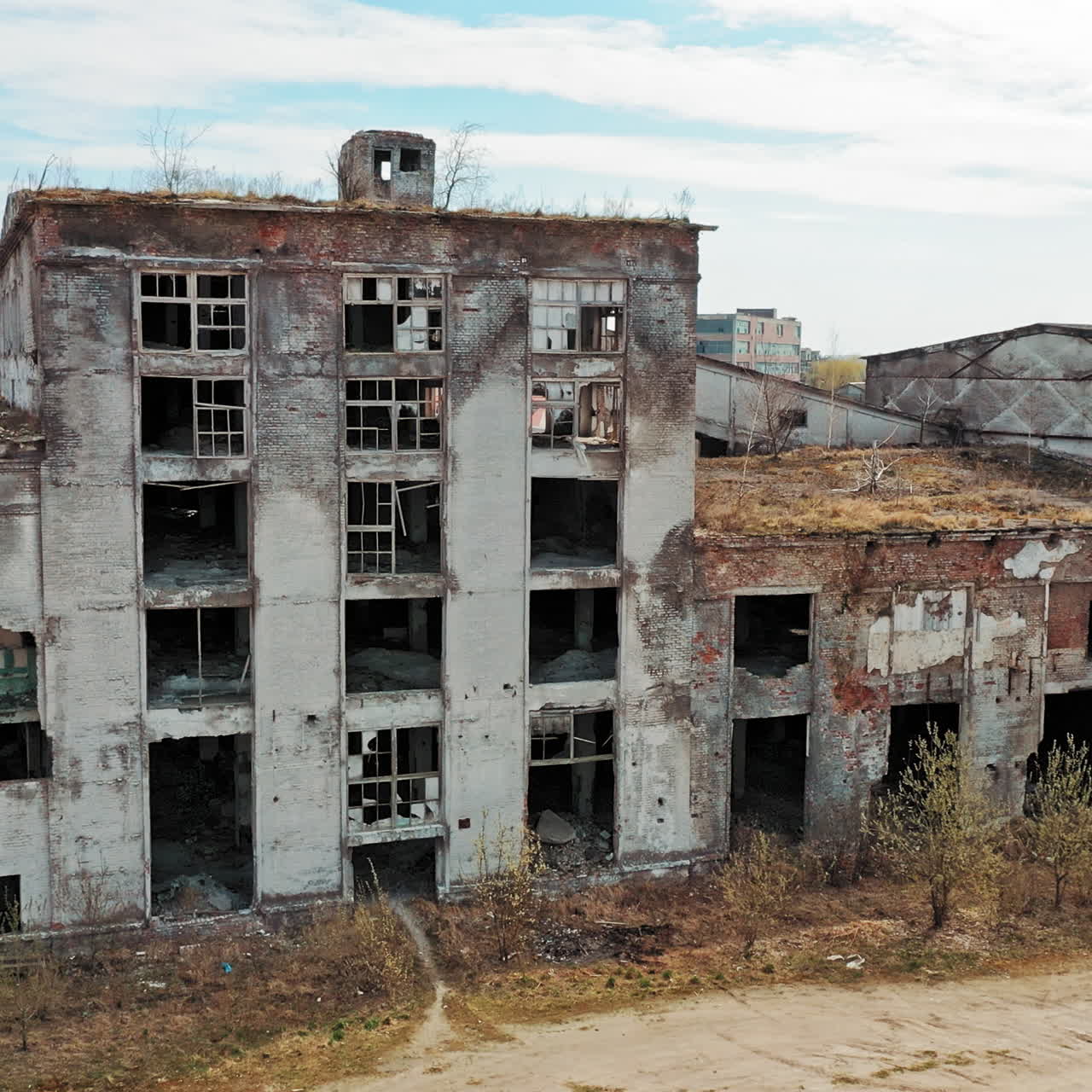 Flight over the destroyed factory. Old industrial building for demolition. Aerial view