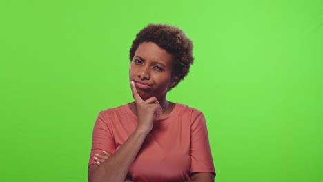 pensive attractive curly african american female being deep in thoughts