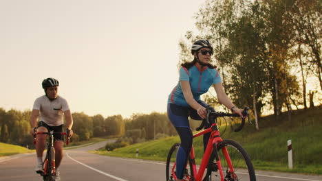 Tracking-shot-of-a-group-of-cyclists-on-country-road.-Fully-released-for-commercial-use.